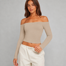 Rivarie Eclipse off-shoulder cover-up top with flowing fabric and stylish neckline, perfect for beach or poolside wear.