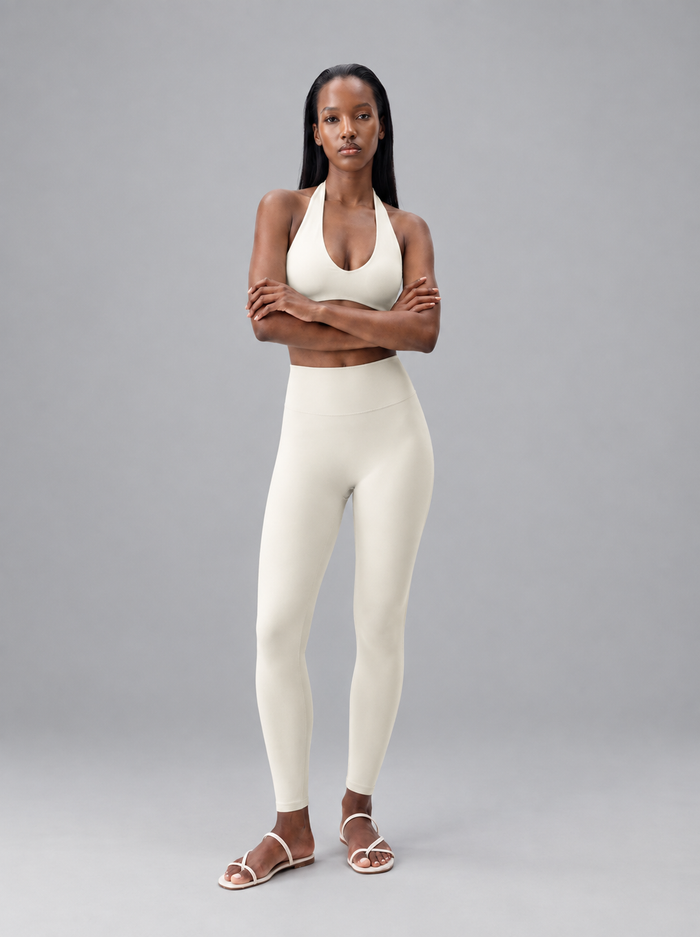Rivarie Glide Contour Leggings showing a close-up of smooth, stretchy fabric with contouring design and high waistband.
